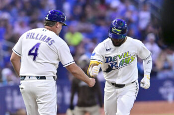Aug 28, 2026; St. Petersburg, Florida, USA;  Tampa Bay Rays outfielder Cedric Mullins, right, celebrates a home run with third base coach Brady Williams (4) during the seventh inning against San Diego Padres at Tropicana Field.  Mandatory Credit: Pablo Robles-Imagn Images