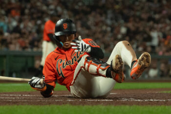 Aug 28, 2026; San Francisco, California, USA;  San Francisco Giants right fielder Jung Hoo Lee (51) falls during the fifth inning against the Arizona Diamondbacks at Oracle Park.  Mandatory Credit: Stan Szeto-Imagn Images