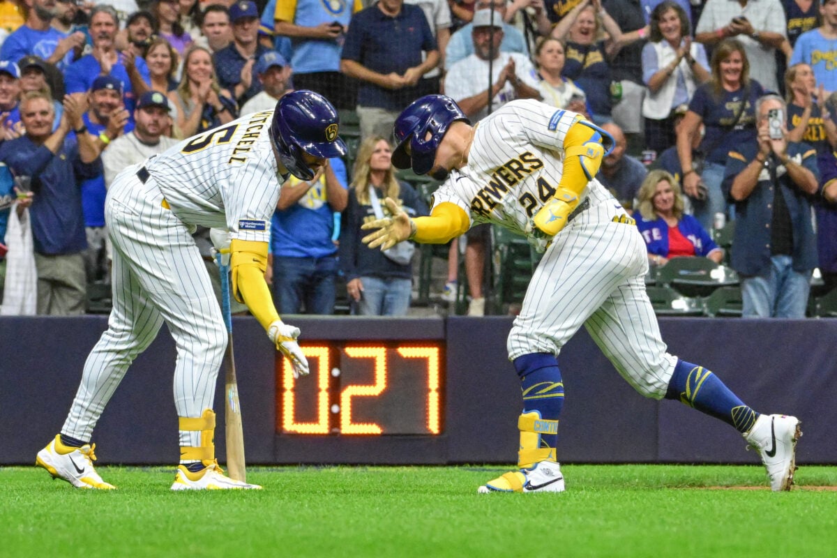 Aug 29, 2026; Milwaukee, Wisconsin, USA;  Milwaukee Brewers catcher William Contreras (24) celebrates with center fielder Garrett Mitchell, left, after hitting a solo home run in the first inning against the Texas Rangers at American Family Field.  Mandatory Credit: Benny Sieu-Imagn Images