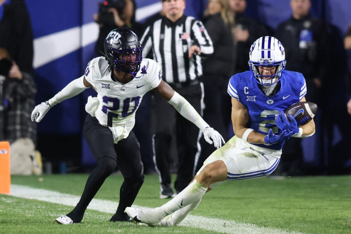 Nov 15, 2025; Provo, Utah, USA; BYU Cougars wide receiver Chase Roberts (2) makes a catch against Texas Christian University Horned Frogs cornerback Jevon McIver Jr. (20) but is called incomplete after a video review during the second half at LaVell Edwards Stadium. Mandatory Credit: Rob Gray-Imagn Images