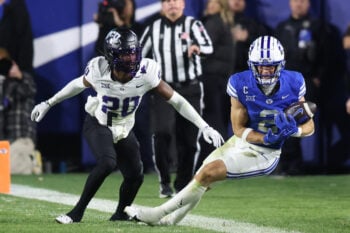 Nov 15, 2025; Provo, Utah, USA; BYU Cougars wide receiver Chase Roberts (2) makes a catch against Texas Christian University Horned Frogs cornerback Jevon McIver Jr. (20) but is called incomplete after a video review during the second half at LaVell Edwards Stadium. Mandatory Credit: Rob Gray-Imagn Images