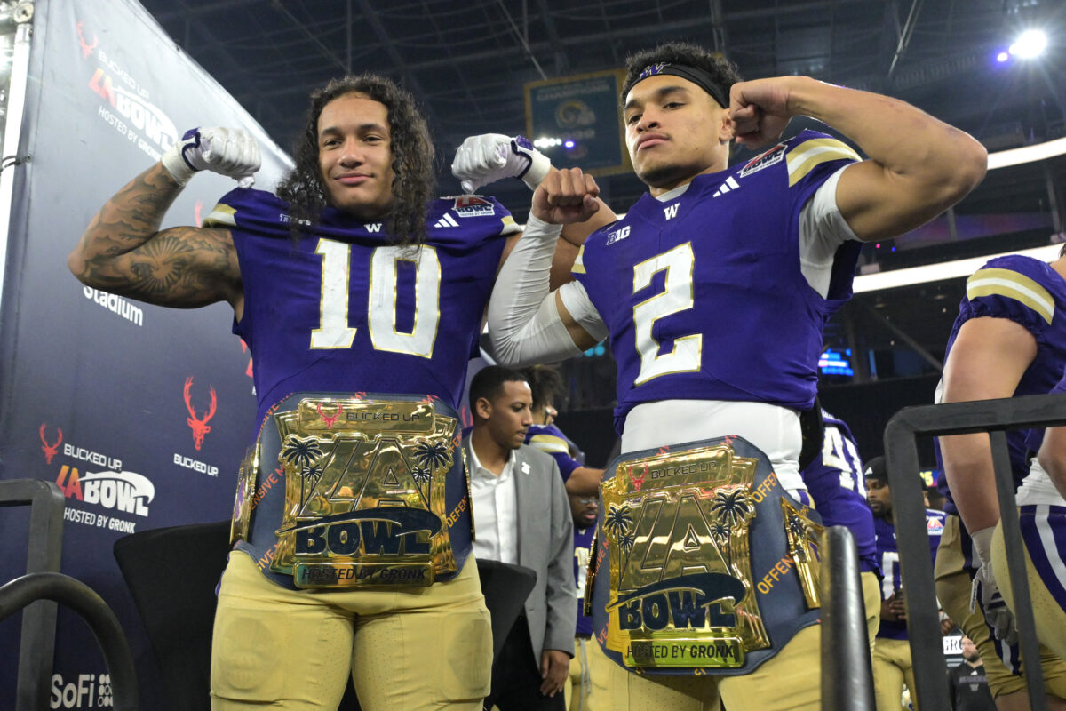 Dec 13, 2025; Inglewood, CA, USA; Washington Huskies linebacker Xe'Ree Alexander (10) and quarterback Demond Williams Jr. (2) celebrate after being named offensive and defensive players of the game as they defeating the Boise State Broncos in the LA Bowl at SoFi Stadium. Mandatory Credit: Jayne Kamin-Oncea-Imagn Images
