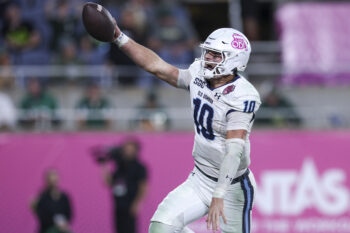 Dec 17, 2025; Orlando, FL, USA; Old Dominion Monarchs quarterback Quinn Henicle (10) runs into the end-zone for a touchdown against the South Florida Bulls in the fourth quarterduring the Cure Bowl at Camping World Stadium. Mandatory Credit: Nathan Ray Seebeck-Imagn Images