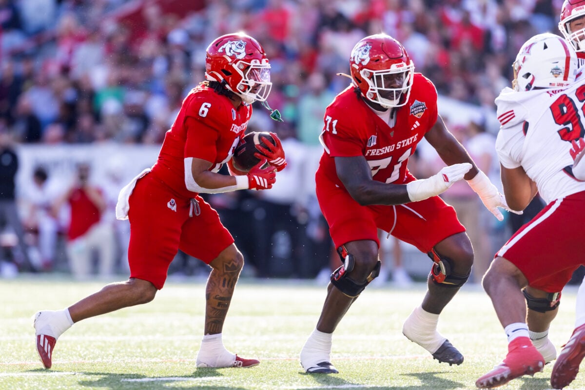 Dec 27, 2025; Tucson, AZ, USA; Fresno State Bulldogs offensive lineman Rolan Fullwood (71) blocks for running back Bryson Donelson (6) against the Miami (OH) RedHawks during the Snoop Dogg Arizona Bowl at Casino Del Sol Stadium. Mandatory Credit: Mark J. Rebilas-Imagn Images