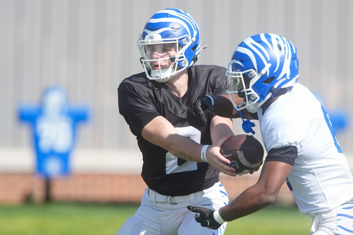 Memphis’ Marcus Stokes (2) hands Jaylin Carter (6) the ball in a drill during practice at the Billy J. Murphy Athletic Complex in Memphis, Tenn., on March 27, 2026.