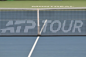 Aug 3, 2026; Montreal, QC], Canada; ATP Tour logo on a net during first round play at IGA Stadium. Mandatory Credit: Eric Bolte-Imagn Images