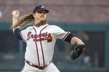 Aug 4, 2026; Cumberland, Georgia, USA; Atlanta Braves pitcher Grant Holmes (66) pitches against the Miami Marlins during the first inning at Truist Park. Mandatory Credit: Dale Zanine-Imagn Images