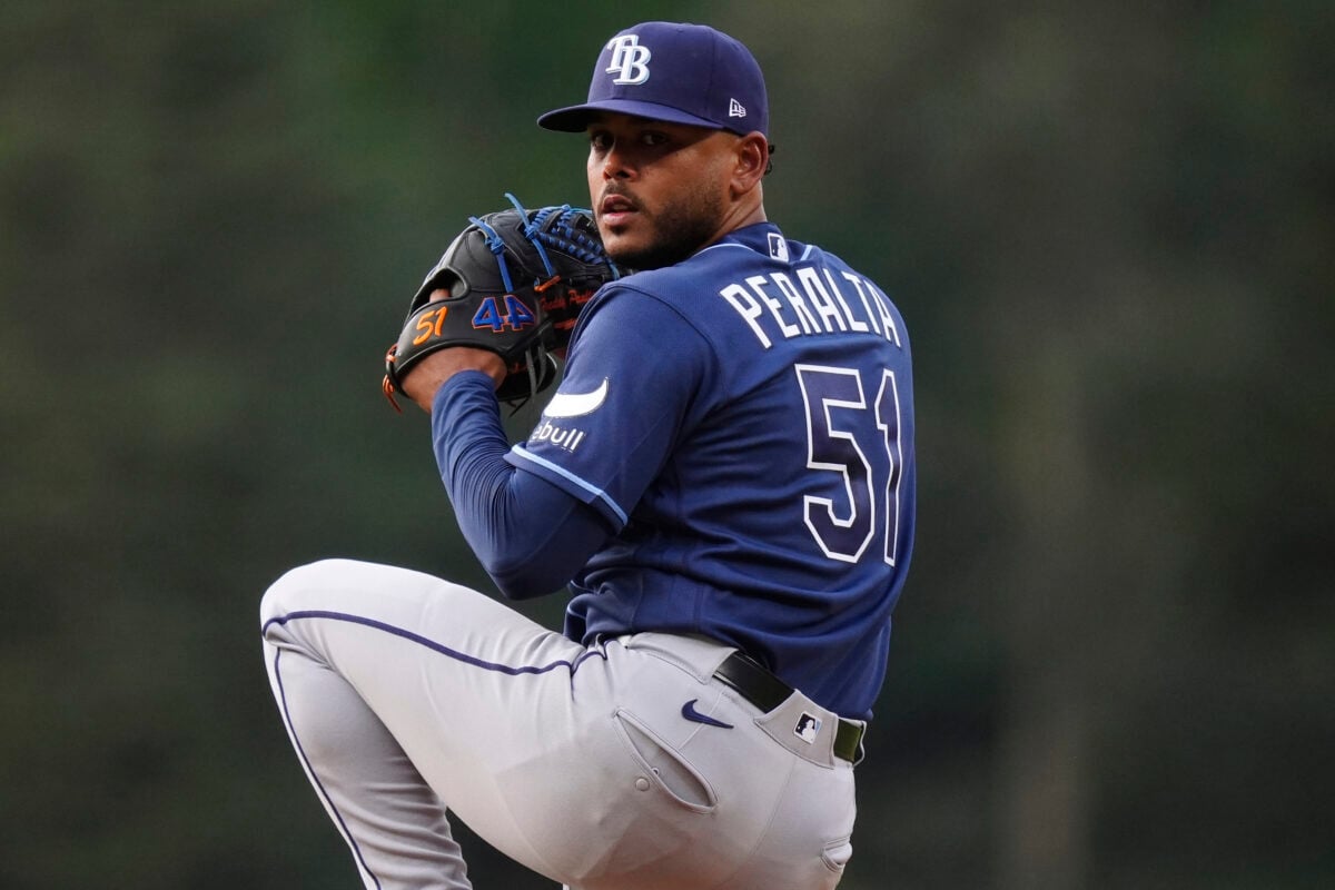 Aug 4, 2026; Denver, Colorado, USA; Tampa Bay Rays starting pitcher Freddy Peralta (51) delivers a pitch in the first inning against the Colorado Rockies at Coors Field. Mandatory Credit: Ron Chenoy-Imagn Images
