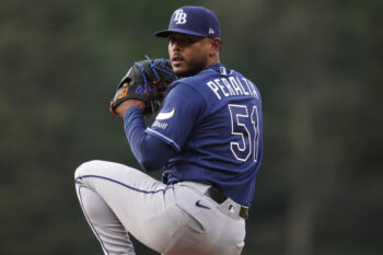 Aug 4, 2026; Denver, Colorado, USA; Tampa Bay Rays starting pitcher Freddy Peralta (51) delivers a pitch in the first inning against the Colorado Rockies at Coors Field. Mandatory Credit: Ron Chenoy-Imagn Images