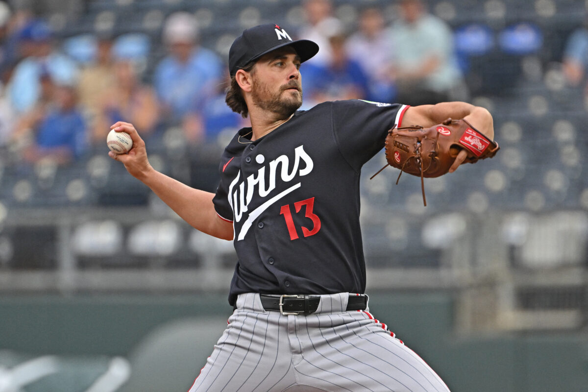 Aug 5, 2026; Kansas City, Missouri, USA; Minnesota Twins starting pitcher Dean Kremer (13) throws a pitch in the first inning against the Kansas City Royals at Kauffman Stadium. Mandatory Credit: Peter Aiken-Imagn Images