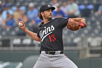 Aug 5, 2026; Kansas City, Missouri, USA;  Minnesota Twins starting pitcher Dean Kremer (13) throws a pitch in the first inning against the Kansas City Royals at Kauffman Stadium. Mandatory Credit: Peter Aiken-Imagn Images