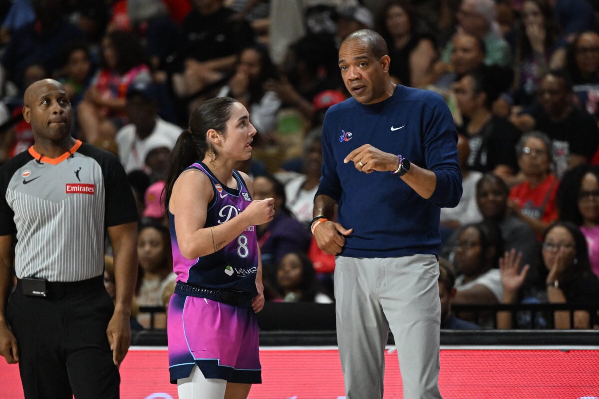 Aug 7, 2026; Washington, District of Columbia, USA; Washington Mystics head coach Sydney Johnson talks with guard Georgia Amoore (8) against the Atlanta Dream during the second half at CareFirst Arena. Mandatory Credit: Brad Mills-Imagn Images