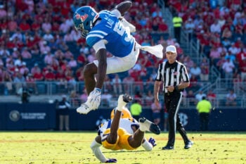 Ole Miss running back Kewan Lacy (5) jumps over a defender during a college football game between Ole Miss and LSU at Vaught-Hemingway Stadium in Oxford, Miss., on Saturday, Sept. 27, 2025. Ole Miss defeated LSU 24-19.