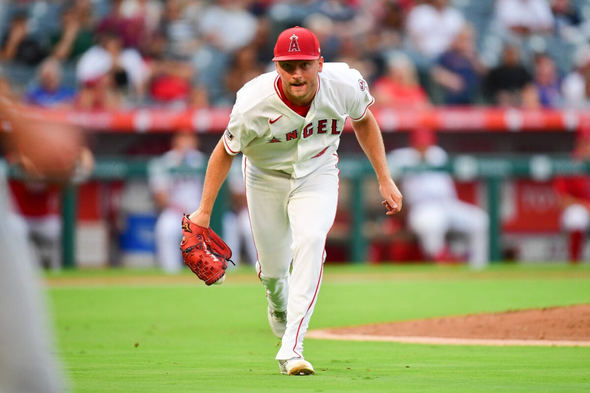 Aug 10, 2026; Anaheim, California, USA; Los Angeles Angels pitcher Reid Detmers (48) fields the bunt of Texas Rangers second baseman Cam Cauley (27) during the third inning at Angel Stadium. Mandatory Credit: Gary A. Vasquez-Imagn Images