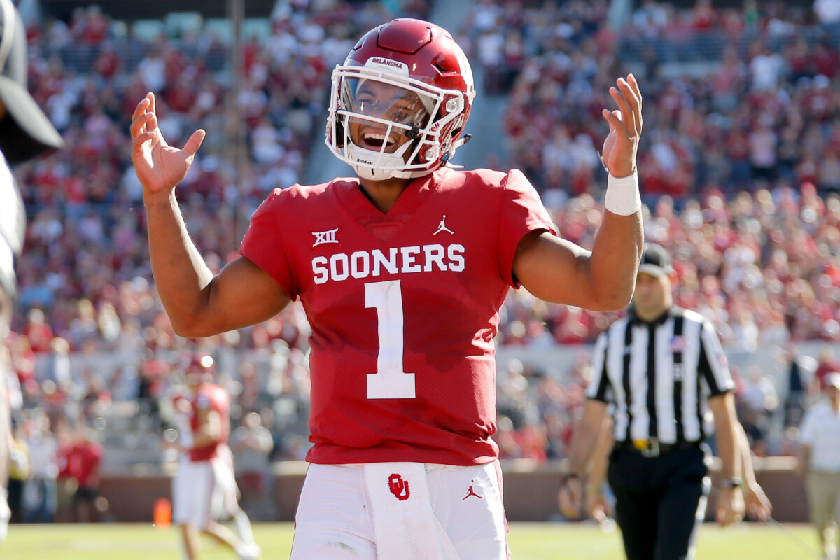Oklahoma's Kyler Murray (1) smiles after throwing a touchdown pass during a college football game between the University of Oklahoma Sooners (OU) and the Kansas State Wildcats at Gaylord Family-Oklahoma Memorial Stadium in Norman, Okla., Saturday, Oct. 27, 2018.