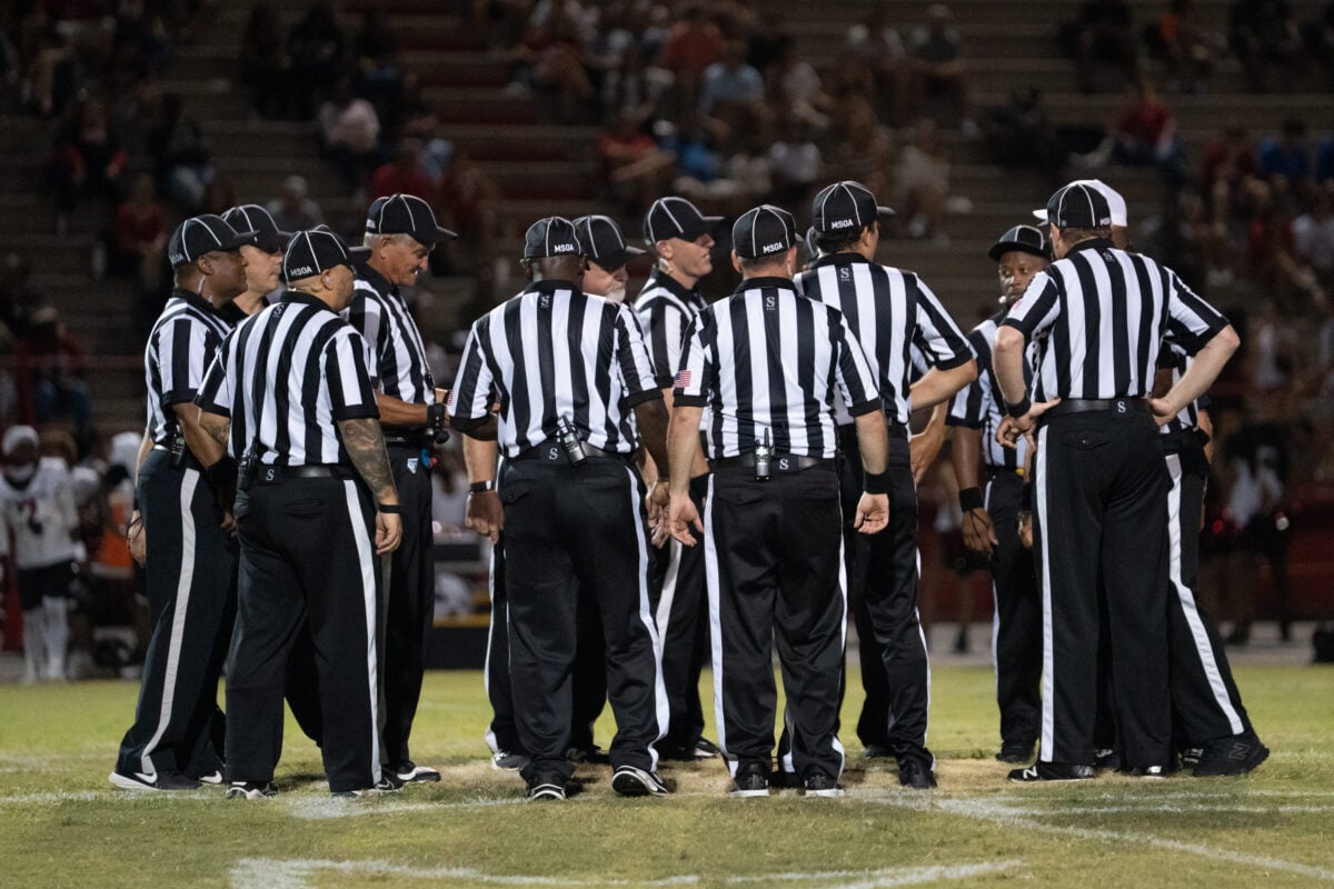 The referees meet at midfield prior to the West Florida vs Pace preseason football game at Pace High School on Aug. 13, 2026.