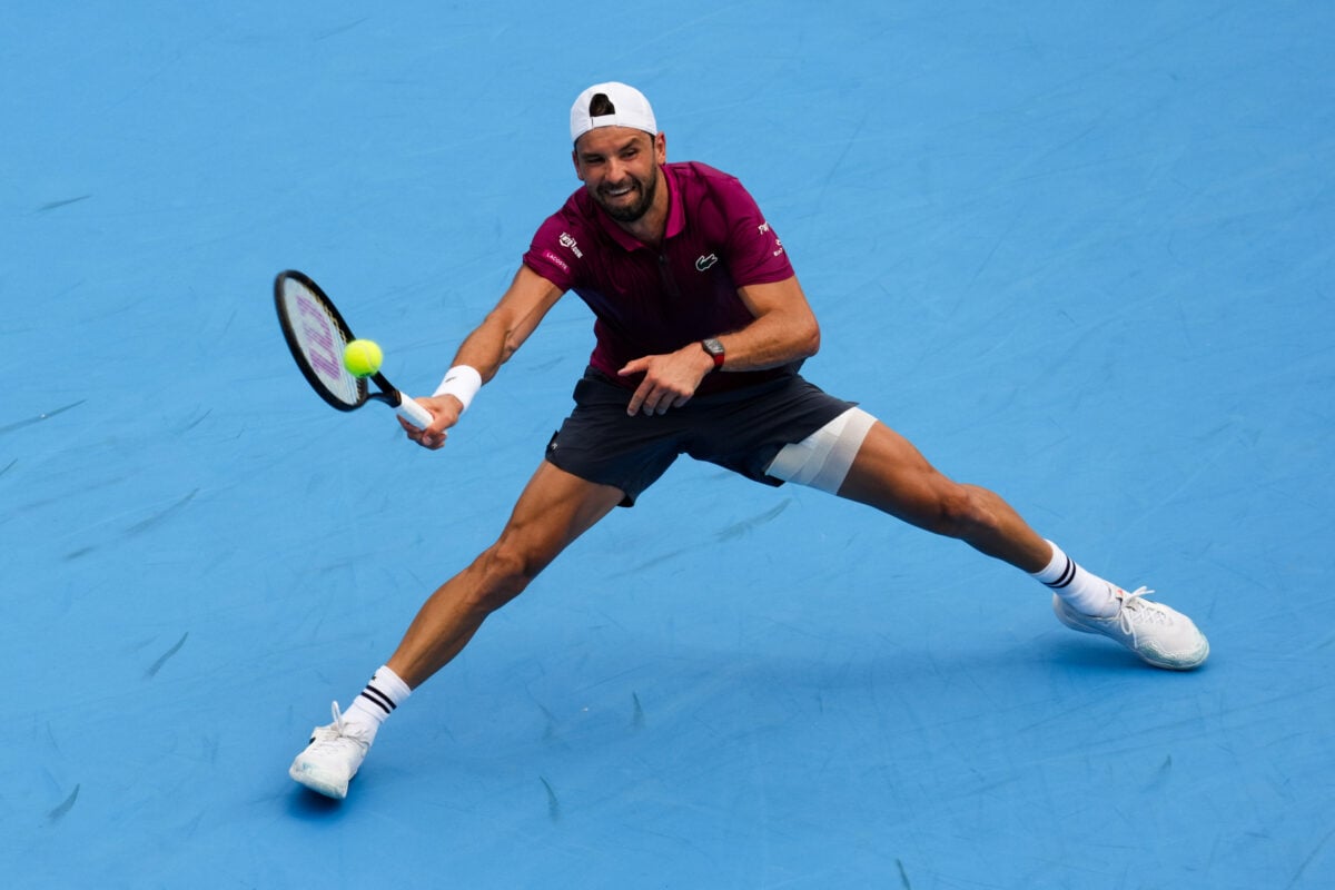 Aug 14, 2026; Mason, OH, USA; Grigor Dimitrov (BUL) returns a shot against Sebastian Baez (ARG) during the Cincinnati Open at Lindner Family Tennis Center. Mandatory Credit: Aaron Doster-Imagn Images