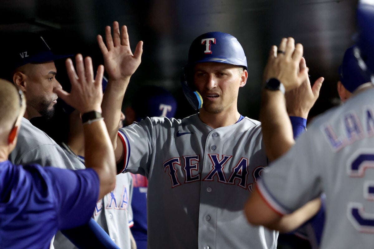 Aug 15, 2026; West Sacramento, California, USA; Texas Rangers short stop Corey Seager (5) celebrates with teammates after scoring a run against the Athletics during the sixth inning at Sutter Health Park. Mandatory Credit: Dennis Lee-Imagn Images