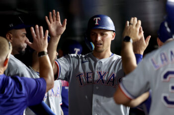 Aug 15, 2026; West Sacramento, California, USA; Texas Rangers short stop Corey Seager (5) celebrates with teammates after scoring a run against the Athletics during the sixth inning at Sutter Health Park. Mandatory Credit: Dennis Lee-Imagn Images