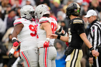 Ohio State Buckeyes defensive end Caden Curry (92) and defensive tackle Kayden McDonald (98) celebrate behidn Purdue Boilermakers quarterback Ryan Browne (15) during the NCAA football game at Ross-Ade Stadium in West Lafayette, Ind. on Nov. 8, 2025.