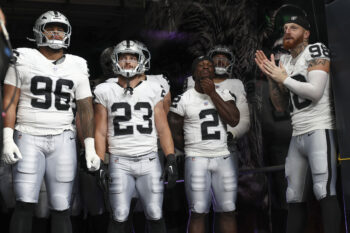 Aug 20, 2026; Houston, Texas, USA;  Las Vegas Raiders defensive tackle Jonah Laulu (96) and running back Dylan Laube (23) and running back Ashton Jeanty (2) and defensive end Maxx Crosby (98) wait to take the field before the game against the Houston Texans at Reliant Stadium. Mandatory Credit: Troy Taormina-Imagn Images
