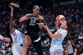 Aug 23, 2026; Vancouver, British Columbia, CAN;  Las Vegas Aces center A'ja Wilson (22) battles for the rebound against Toronto Tempo forward Ornella Bankole (33) and guard Kiki Rice (1) in the second half at Rogers Arena.  Mandatory Credit: Bob Frid-Imagn Images