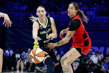 Aug 25, 2026; Arlington, Texas, USA;  Dallas Wings guard Paige Bueckers (5) makes a pass against Portland Fire forward Emily Engstler (21) during the first half at College Park Center.  Mandatory Credit: Chris Jones-Imagn Images