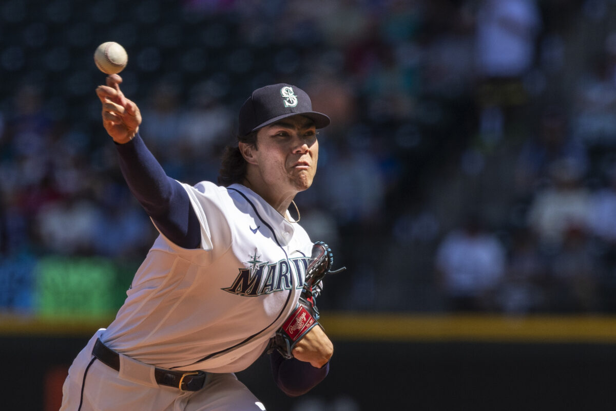Aug 26, 2026; Seattle, Washington, USA; Seattle Mariners starting pitcher Bryan Woo (22) throws against the Philadelphia Phillies during the first inning at T-Mobile Park. Mandatory Credit: Joe Nicholson-Imagn Images