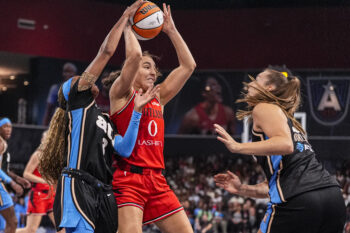 Aug 28, 2026; College Park, Georgia, USA; Portland Fire guard Carla Leite (0) controls the ball over Atlanta Dream guard Jordin Canada (3) during the first half at Gateway Center Arena at College Park. Mandatory Credit: Dale Zanine-Imagn Images