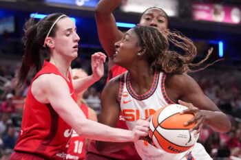Indiana Fever guard Caitlin Clark (22) defends Connecticut Sun forward Diamond Miller (1) as she looks to shoot during a game on Friday, Aug. 28, 2026, at Gainbridge Fieldhouse in Indianapolis. The Fever defeated the Sun 111-91.