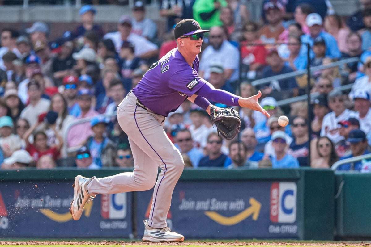Aug 29, 2026; Cumberland, Georgia, USA; Colorado Rockies first baseman TJ Rumfield (7) flips the ball for a force out against the Atlanta Braves during the second inning at Truist Park. Mandatory Credit: Dale Zanine-Imagn Images