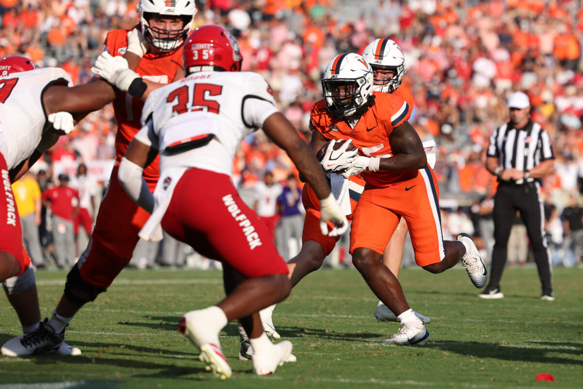 Aug 29, 2026; Charlottesville, Virginia, USA; Virginia Cavaliers running back Xay Davis (25) rushes for touchdown during the fourth quarter of the game against the North Carolina State Wolfpack at Scott Stadium. Mandatory Credit: Greg Atkins-Imagn Images