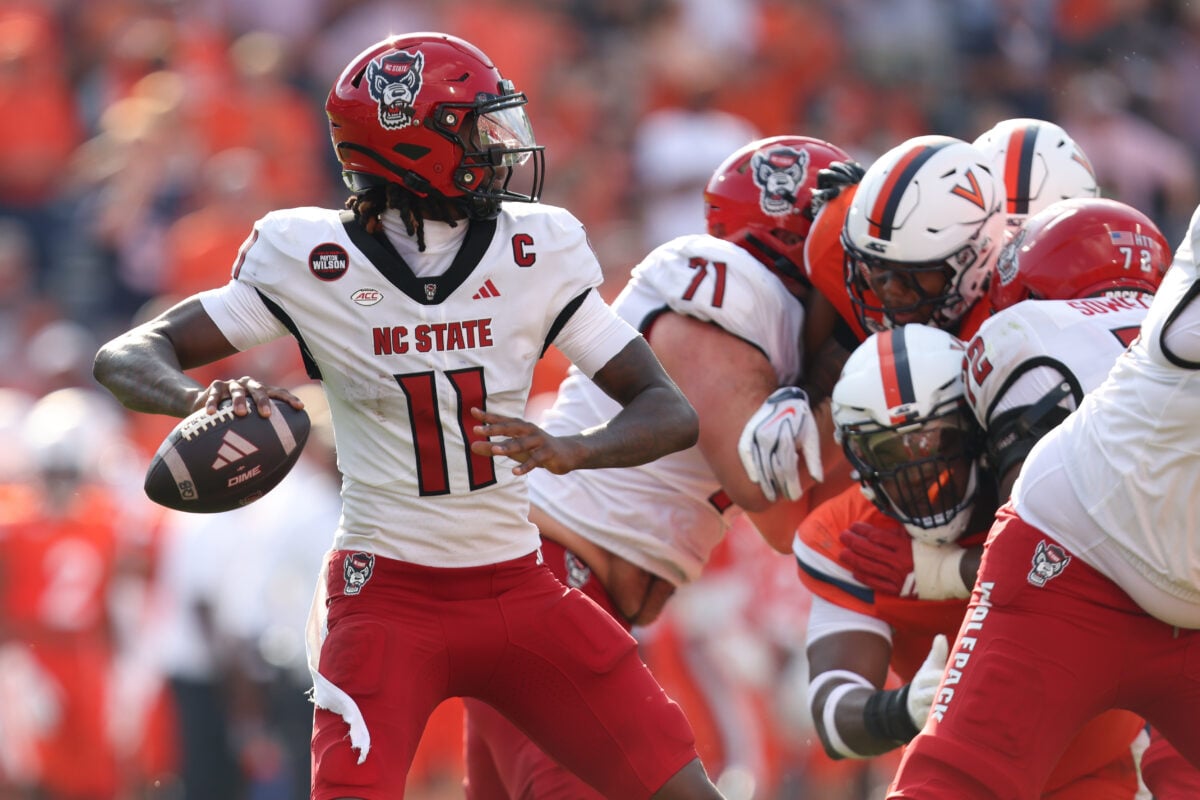 Aug 29, 2026; Charlottesville, Virginia, USA;  North Carolina State Wolfpack quarterback CJ Bailey (11) passes the ball during the game against the Virginia Cavaliers at Scott Stadium.  Mandatory Credit: Greg Atkins-Imagn Images