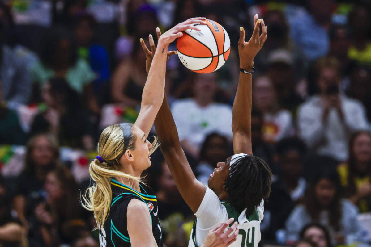 Aug 30, 2026; Seattle, Washington, USA; Los Angeles Sparks forward Cameron Brink (22) blocks a shot attempt by Seattle Storm center Dominique Malonga (14) during the first quarter at Climate Pledge Arena. Mandatory Credit: Joe Nicholson-Imagn Images