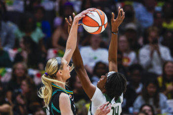 Aug 30, 2026; Seattle, Washington, USA; Los Angeles Sparks forward Cameron Brink (22) blocks a shot attempt by Seattle Storm center Dominique Malonga (14) during the first quarter at Climate Pledge Arena. Mandatory Credit: Joe Nicholson-Imagn Images