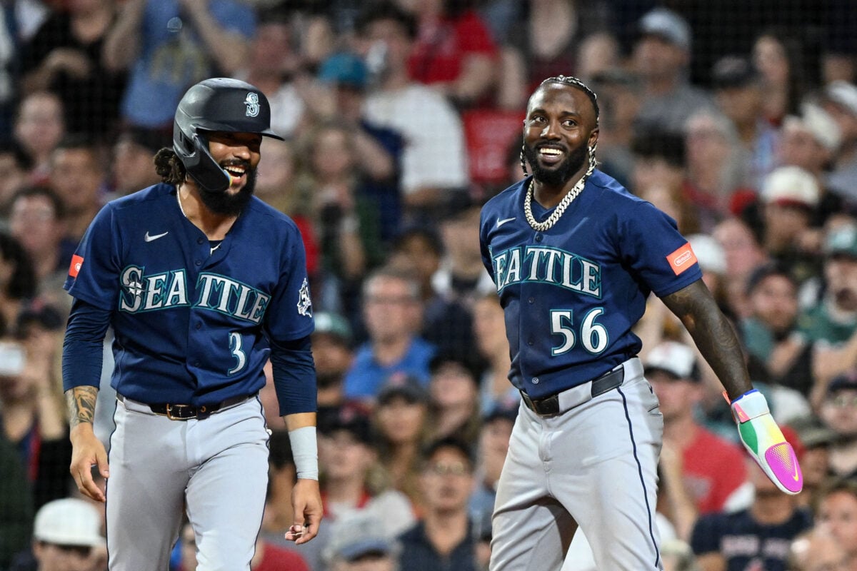 Aug 31, 2026; Boston, Massachusetts, USA; Seattle Mariners shortstop J.P. Crawford (3) and left fielder Randy Arozarena (56) react after scoring a run against the Boston Red Sox during the sixth inning at Fenway Park. Mandatory Credit: Brian Fluharty-Imagn Images
