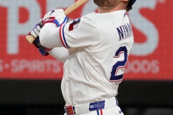 Aug 31, 2026; Arlington, Texas, USA;  Texas Rangers right fielder Brandon Nimmo (24) hits a run scoring sacrifice fly against the Athletics during the fifth inning at Globe Life Field. Mandatory Credit: Raymond Carlin III-Imagn Images