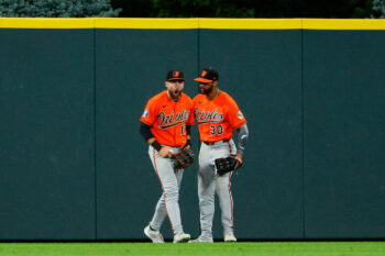 Aug 31, 2026; Denver, Colorado, USA; Baltimore Orioles center fielder Colton Cowser (17) reacts with right fielder Leody Taveras (30) after making a catch at the fence in the ninth inning against the Colorado Rockies at Coors Field. Mandatory Credit: Isaiah J. Downing-Imagn Images