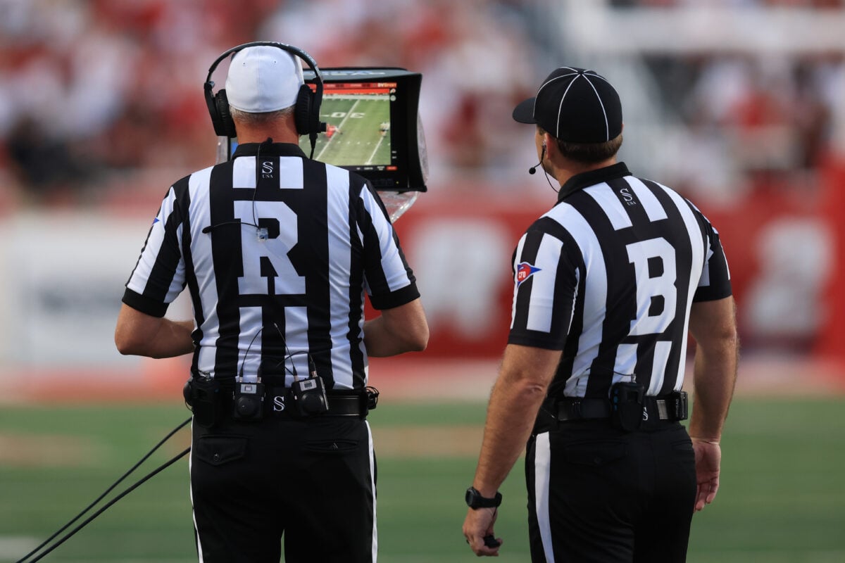 Sep 3, 2026; Salt Lake City, Utah, USA;  Referees review a play on the sidelines monitor during the first quarter of the game between the Utah Utes and against the Idaho Vandals at Rice-Eccles Stadium.  Mandatory Credit: Rob Gray-Imagn Images