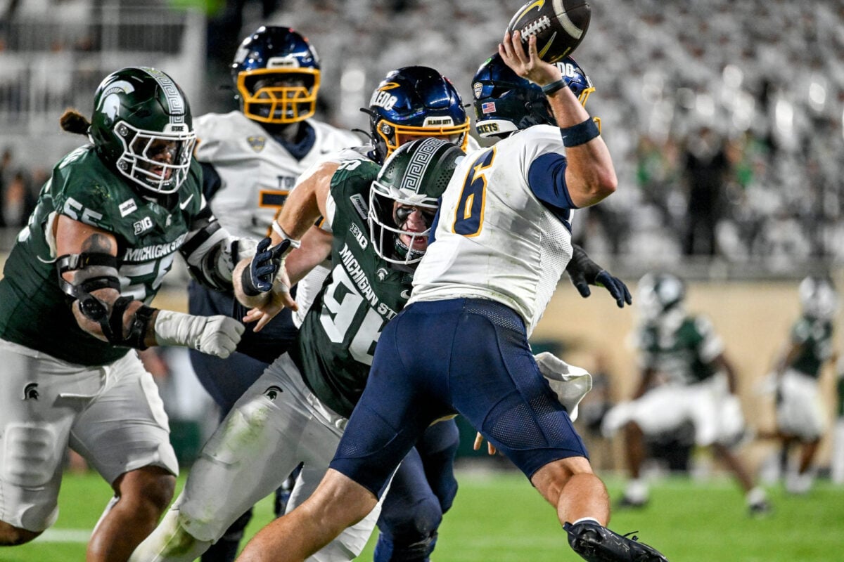 Michigan State’s Eli Coenen, left, pressures Toledo’s John Alan Richter during the third quarter on Friday, Sept. 4, 2026, at Spartan Stadium in East Lansing.