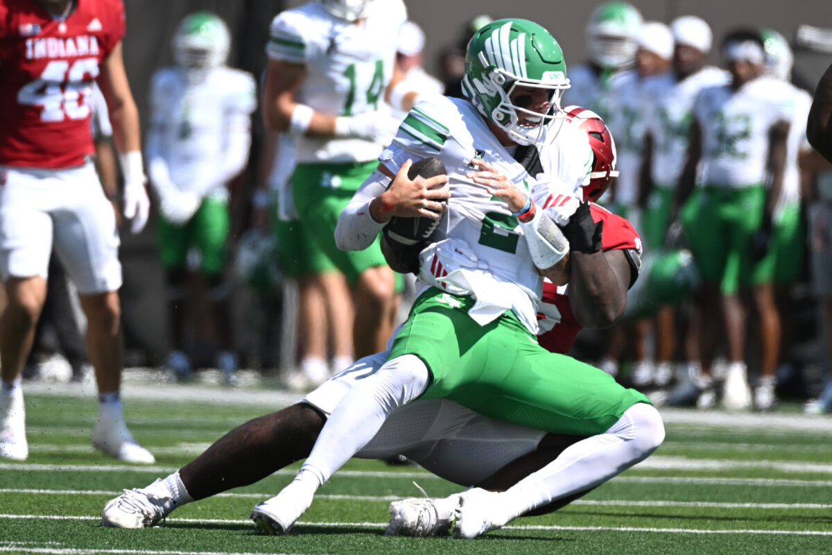 Sep 5, 2026; Bloomington, Indiana, USA; North Texas Mean Green quarterback Tayven Jackson (2) is sacked by Indiana Hoosiers defensive lineman Tyrique Tucker (95) during the first quarter at Merchants Bank Field at Memorial Stadium. Mandatory Credit: Robert Goddin-Imagn Images