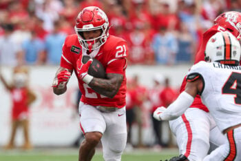 Sep 5, 2026; Houston, Texas, USA; Houston Cougars running back Makhi Hughes (21) runs with the ball during the first quarter against the Oregon State Beavers at TDECU Stadium. Mandatory Credit: Troy Taormina-Imagn Images