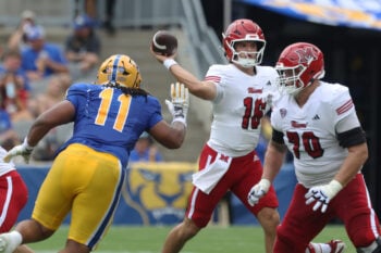 Sep 5, 2026; Pittsburgh, Pennsylvania, USA;  Miami (OH) RedHawks quarterback David McComb (16) passes the ball against pressure from Pittsburgh Panthers defensive lineman Nick James (11) during the second quarter at Acrisure Stadium.  Mandatory Credit: Charles LeClaire-Imagn Images