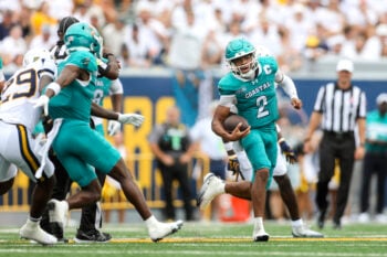Sep 5, 2026; Morgantown, West Virginia, USA;  Coastal Carolina Chanticleers quarterback Deuce Bailey (2) runs the ball during the third quarter against the West Virginia Mountaineers at Milan Puskar Stadium.  Mandatory Credit: Ben Queen-Imagn Images
