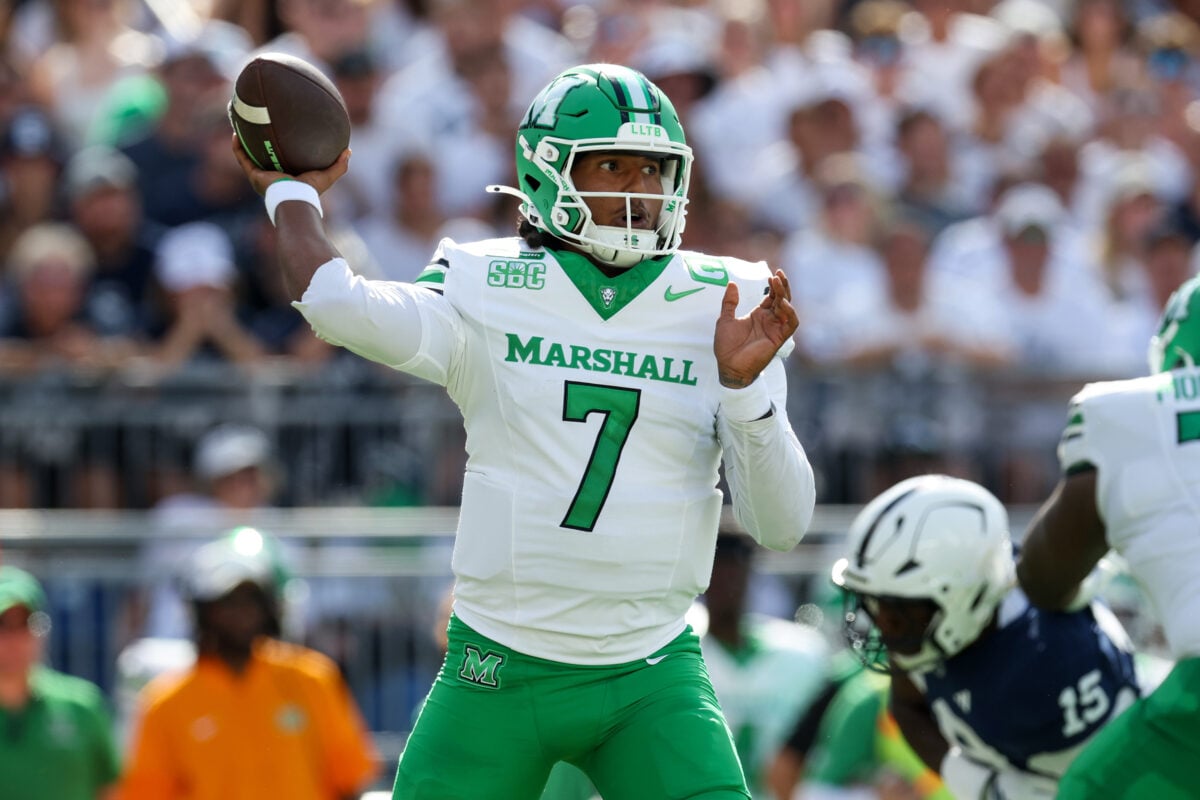 Sep 5, 2026; University Park, Pennsylvania, USA;  Marshall Thundering Herd quarterback Carlos Del Rio-Wilson (7) throws a pass during the first quarter against the Penn State Nittany Lions at West Shore Home Field at Beaver Stadium.  Mandatory Credit: Matthew O'Haren-Imagn Images