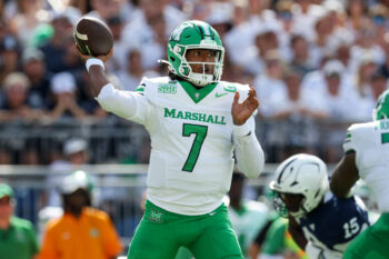 Sep 5, 2026; University Park, Pennsylvania, USA;  Marshall Thundering Herd quarterback Carlos Del Rio-Wilson (7) throws a pass during the first quarter against the Penn State Nittany Lions at West Shore Home Field at Beaver Stadium.  Mandatory Credit: Matthew O'Haren-Imagn Images
