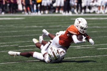Sep 5, 2026; Austin, Texas, USA;  Texas Longhorns running back Raleek Brown (0) is tackled by Texas State Bobcats defensive back Craig Royal Jr. (3) during the second quarter at Darrell K Royal-Texas Memorial Stadium.  Mandatory Credit: Scott Wachter-Imagn Images