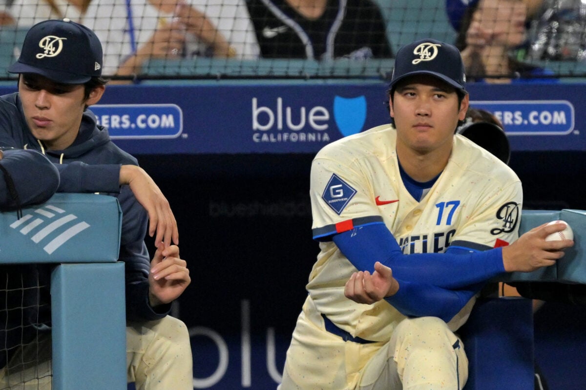 Sep 5, 2026; Los Angeles, California, USA; Los Angeles Dodgers pitcher Roki Sasaki (left) and pitcher Shohei Ohtani (17) watch the game against the Washington Nationals from the dugout during the eighth inning at Dodger Stadium. Mandatory Credit: Jayne Kamin-Oncea-Imagn Images