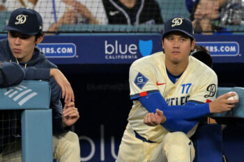 Sep 5, 2026; Los Angeles, California, USA;  Los Angeles Dodgers pitcher Roki Sasaki (left) and pitcher Shohei Ohtani (17) watch the game against the Washington Nationals from the dugout during the eighth inning at Dodger Stadium.  Mandatory Credit: Jayne Kamin-Oncea-Imagn Images