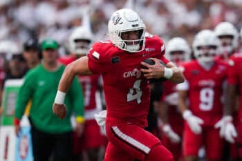 Sep 5, 2026; Cincinnati, Ohio, USA;  Cincinnati Bearcats quarterback JC French IV (4) runs with the ball against the Boston College Eagles in the second half at Nippert Stadium. Mandatory Credit: Aaron Doster-Imagn Images